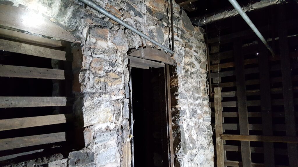 Hidden masonry arch under the house